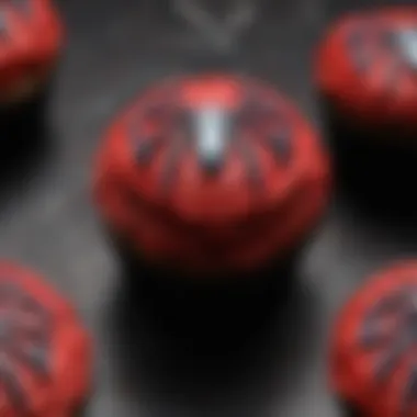 An array of Spider-Man-themed cupcakes decorated with iconic symbols.